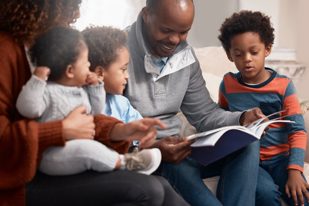 black-family-book-man-reading-sofa-storytelling-comic-development-home-parents-children-dad-with-old-yearbook-couch-joke-history-showing-kids-memories-with-care