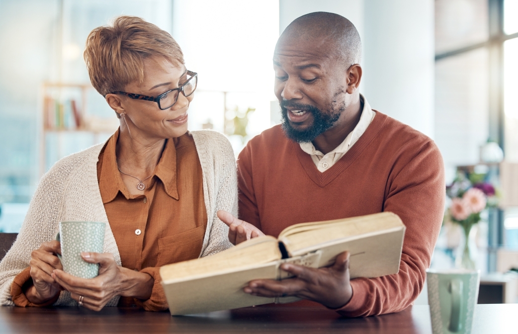christian-prayer-black-couple-reading-bible-book-faith-worship-bible-study-kitchen-living-room-coffee-happy-man-woman-education-study-black-family-church-sunday