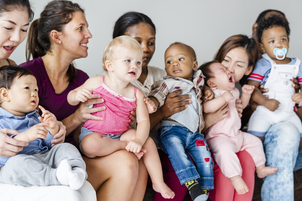 Diverse babies with their parents