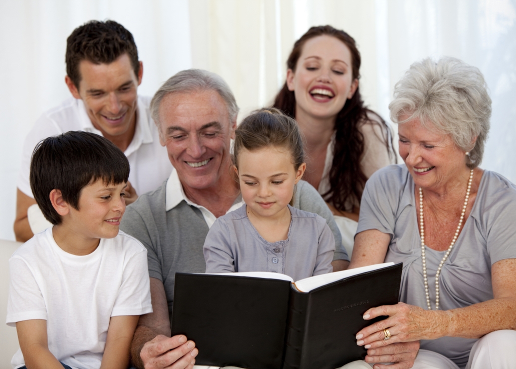 Family looking at a photograph album