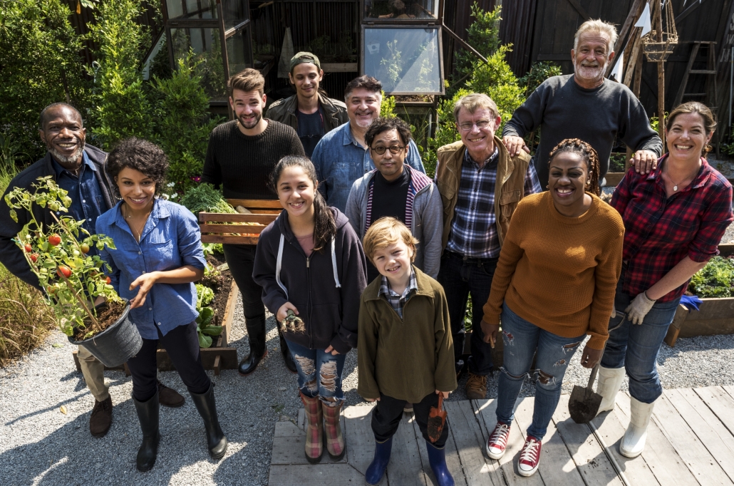 Group of people gardening backyard together
