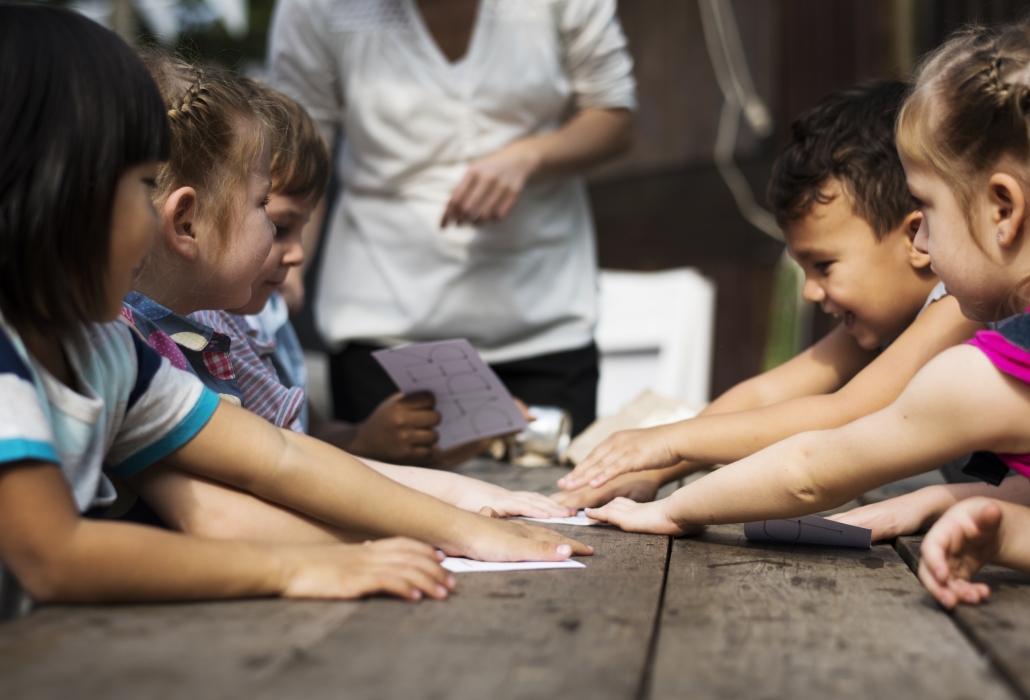 Little Kids Playing Recycle Words Game Together